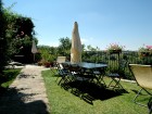 Villa terrace overlooks the pool and panoramic countryside.