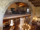 The grand arch of the Villa with library above and kitchen below.