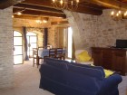 Living room and dining room overlook the pool.