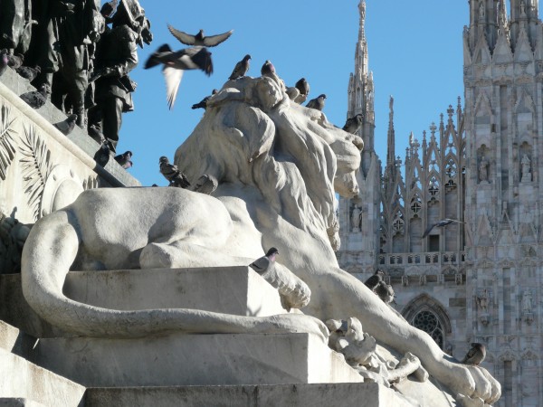 Lion under the statue of Victor Emmanuelle II in Milan