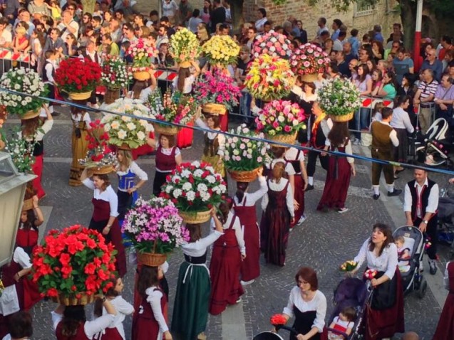 Little ones in baby carriages, flowers in hand